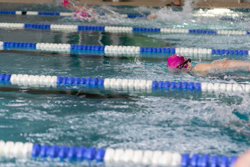 Swimming pool with blue and transparent water. Competition at a sports event.