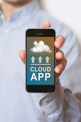 Cloud uploading concept on phone screen. Man hand hold phone with cloud uploading.