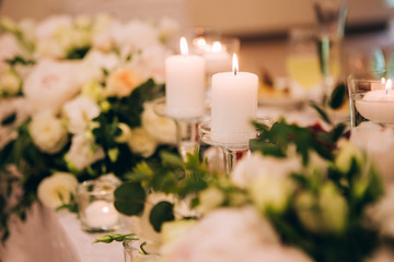 Outgoing wedding ceremony. Decor Studio. white wooden chairs on a green lawn. Wedding festal arch. White armchairs for guests