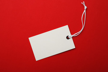 Cardboard tag with space for text on color background, top view