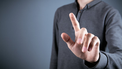 Hand pushing on a touch screen.