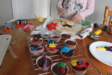 Child decorating cupcakes