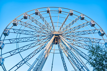 Ferris wheel in an amusement park close up