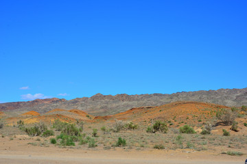 Desert landscape surrounding Singing Dune in Altyn-Emel