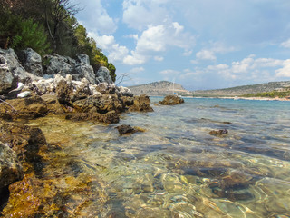 View of the rocky shore of Three island beach.