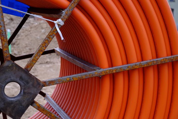 Metal spool of large orange tube