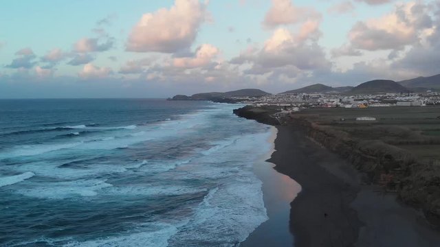 Aerial Drone Azores Portugal sunset over the sea pink clouds
