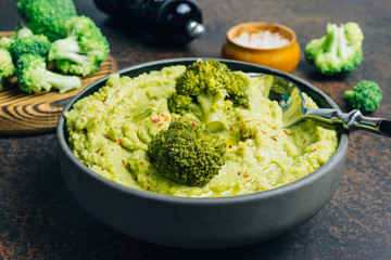 Mashed ripe broccoli in a bowl.