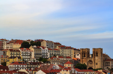 Fototapeta na wymiar Lisbon cityscape with typical houses and Lisbon Cathedral ( Sé de Lisboa)