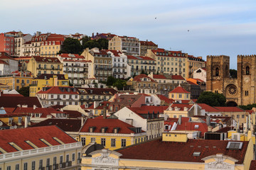 Fototapeta na wymiar Lisbon hill with typical houses and Lisbon Cathedral ( Sé de Lisboa)