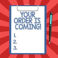 Conceptual hand writing showing Your Order Is Coming. Business photo text Product on the way shipping of purchase products Sheet of Bond Paper on Clipboard with Ballpoint Pen Text Space