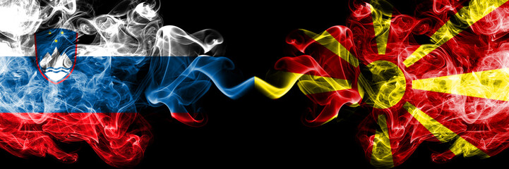 Slovenia, Slovenian, Macedonia, Macedonian competition thick colorful smoky flags. European football qualifications games - obrazy, fototapety, plakaty
