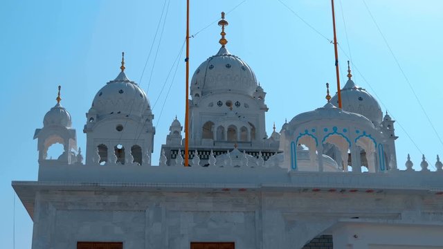 Sikh temple from white marble in the city of Pushkar, India, one of the sacred pilgrimage sites in Hinduism. Shot in motion