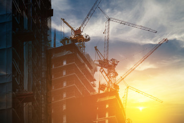 Silhouettes big construction at sunset