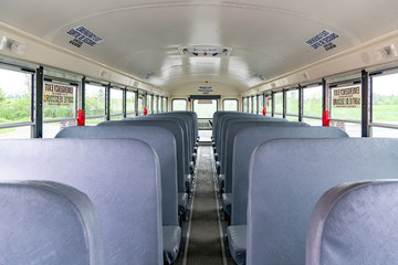 Empty seats inside a school bus