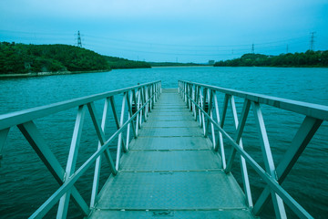 Obraz premium Trestle reaching into the water, waterside, marina