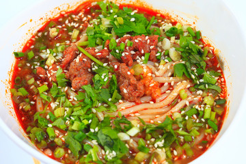 Beef vermicelli red hot soup in white porcelain bowl