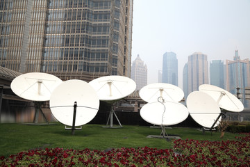 Satellite dish space technology receivers with modern buildings backgrounds