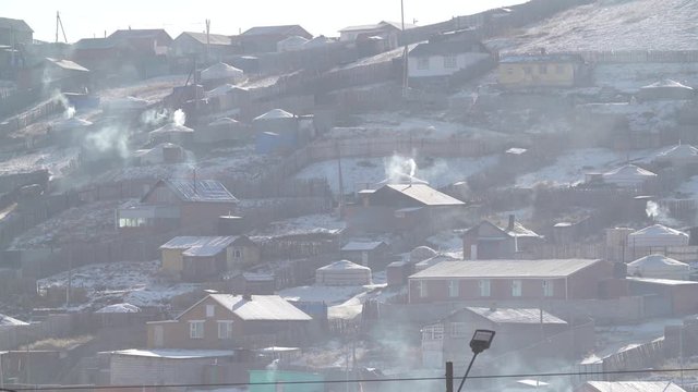 Coal smoke during winter in Mongolian village