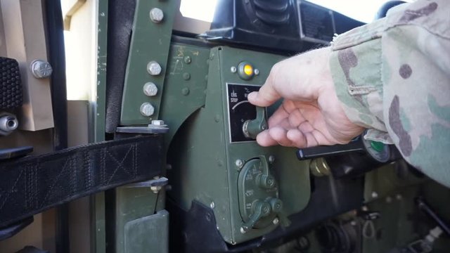 1080p 24fps of an American Army Soldier starting a HMMWV.