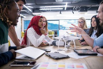 Fototapeta premium multiethnic business team learning about drone technology