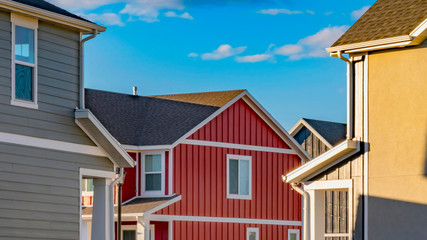Panorama Dry cracked ground between houses lit by sunlight on a sunny day