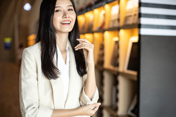 Smiling Asian business woman  looking at the camera  stay office.young Asian business executive happy.