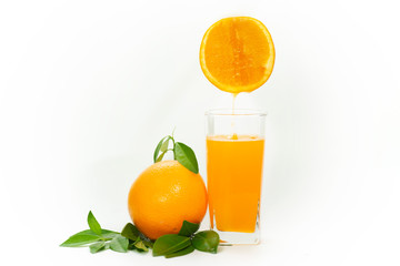 glass of fresh orange juice with fresh fruits isolated on white background.