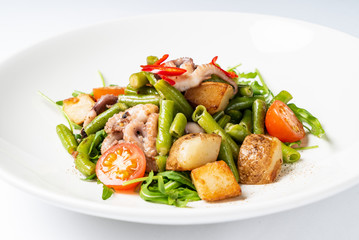 salad with baby octopus and vegetables