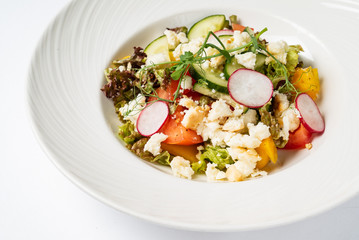 vegetable salad on the white plate
