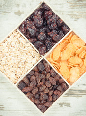 Vintage photo, Dried fruits with various flakes as source carbohydrates, vitamins and fiber, nutritious eating