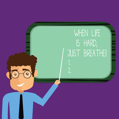 Conceptual hand writing showing When Life Is Hard Just Breathe. Business photo showcasing Take a break to overcome difficulties Man Holding Stick Pointing to Wall Mounted Blank Color Board