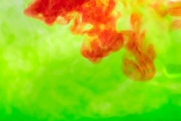 Obraz premium red paint similar to blood tests diluted in green water