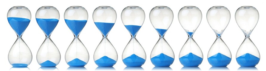 Collection of hourglasses with blue sand showing the passage of time - obrazy, fototapety, plakaty