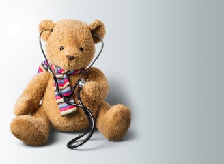 Male doctor with stethoscope on hospital background