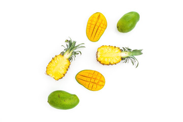 Tropical pineapple and mango fruits on white background. Sliced fruits. Flat lay, top view.