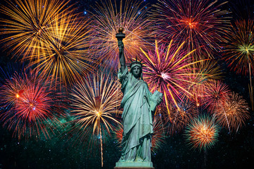 Statue of Liberty over the Multicolor Fireworks Celebrate with the milky way background, 4th of...