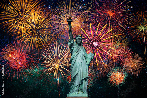 Statue of Liberty over the Multicolor Fireworks Celebrate with the milky way background, 4th of July and Independence day concept