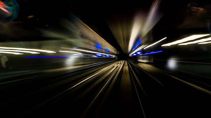 Motion blur train moving in city rail tunnel. Motion blur background abstract.