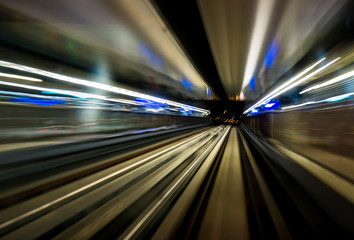 Fototapeta na wymiar Motion blur train moving in city rail tunnel. Motion blur background abstract.