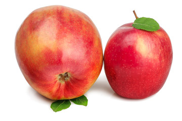 Red apples with green leaves isolated on white background