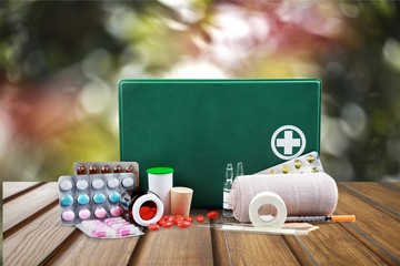 First Aid Kit and bandages  on background