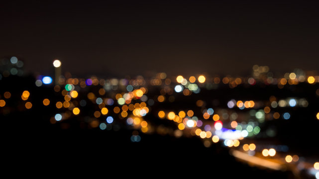 image of colorful blurred defocused bokeh Lights. motion and nightlife concept.