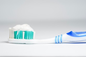 Toothbrush with toothpaste isolated on white background