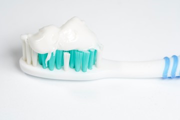 Toothbrush with toothpaste isolated on white background