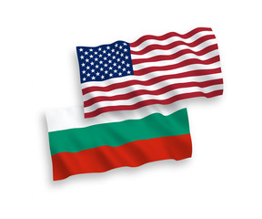 National vector fabric wave flags of Bulgaria and America isolated on white background. 1 to 2 proportion.