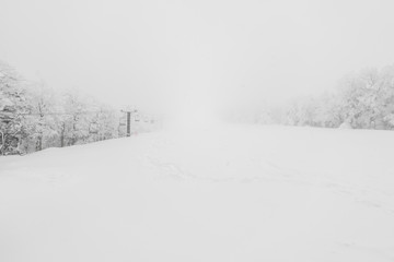 Ski lift over snow mountain in ski resort .