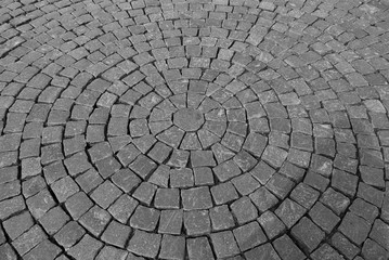 pavement of cobblestonesGray Pavement of cobblestones laid in concentric circles