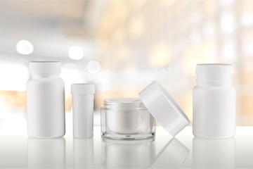 Cosmetic containers isolated on background