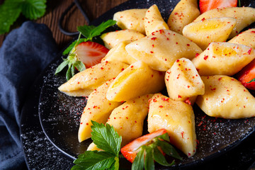 Kopytka - polish potato dumpling with strawberries